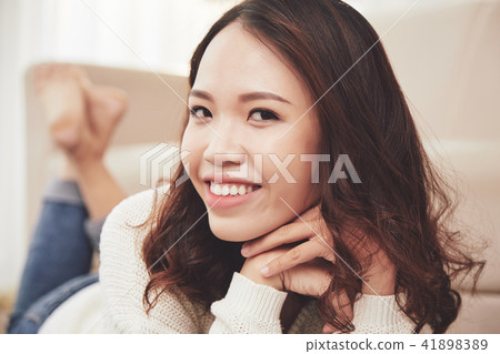 Pretty woman resting at home 41898389
