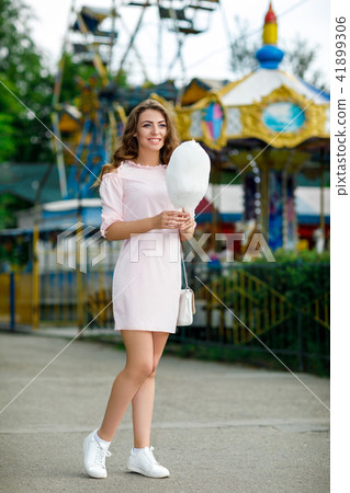 attractive woman holding sweet cotton candy 41899306