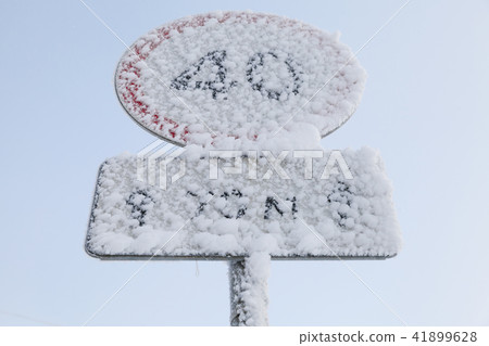 Frosted speed limit road sign in winter 41899628