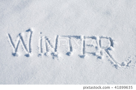Winter. Hand drawn text over white snow Winter. Hand drawn text over white snow 41899635