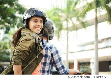Young woman enjoyng bike ride Young woman enjoyng bike ride 41899970