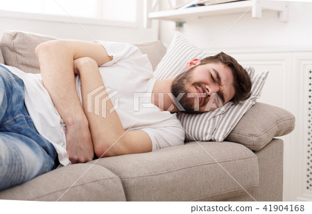 Frustrated handsome young man with stomachache 41904168
