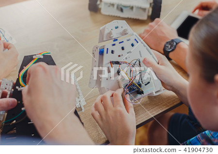 Stem education. Kids creating robots with teacher Stem education. Kids creating robots with teacher 41904730