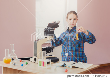 Stem education. Teenage girl make chemical research Stem education. Teenage girl make chemical research 41905037