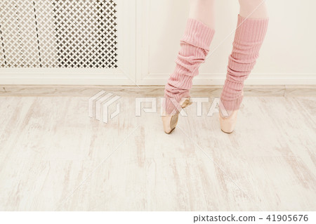 Legs of ballet dancer wearing gaiters closeup 41905676