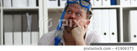 Man wearing suit and tie in goggles with snorkel 41906373