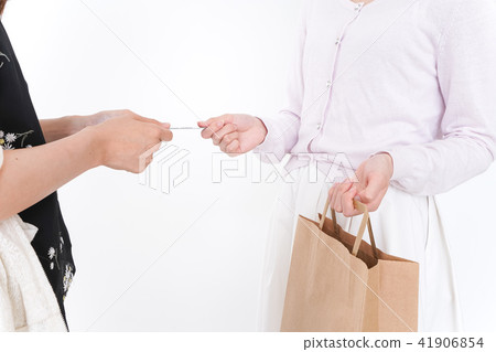 Women paying with credit card 41906854