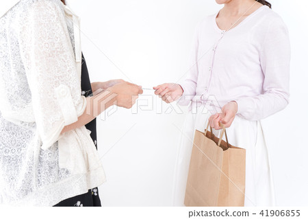 Women paying with credit card 41906855