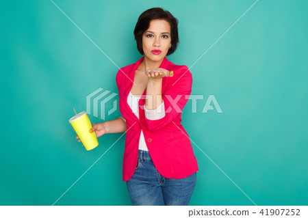 Happy girl in bright casual clothing at studio background Happy girl in bright casual clothing at studio background 41907252