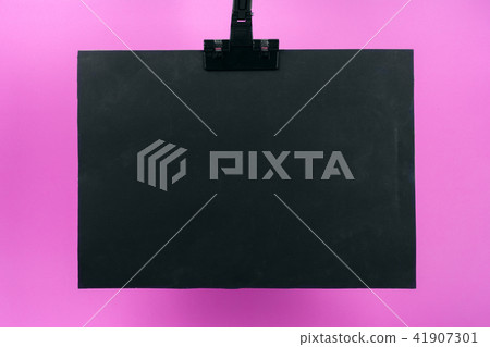 Black Poster on Pink Background. 41907301
