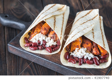 Chicken burritos on the wooden board 41907740