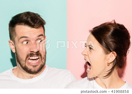 attractive angry couple fighting and shouting at each other attractive angry couple fighting and shouting at each other 41908858