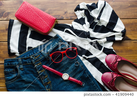 clothing for women, placed on a wooden floor. clothing for women, placed on a wooden floor. 41909440