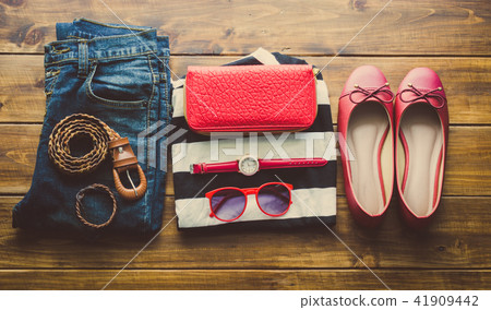 clothing for women, placed on a wooden floor. clothing for women, placed on a wooden floor. 41909442