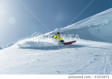 The total length of skiing on fresh snow powder. Professional skier outside the track on a sunny day 41910873