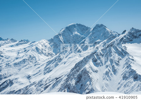 Winter snow covered mountain peaks in Caucasus. Great place for winter sports 41910905