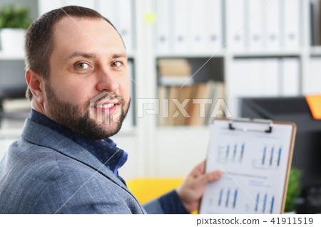 portrait of young handsome promising businessman in office portrait of young handsome promising businessman in office 41911519