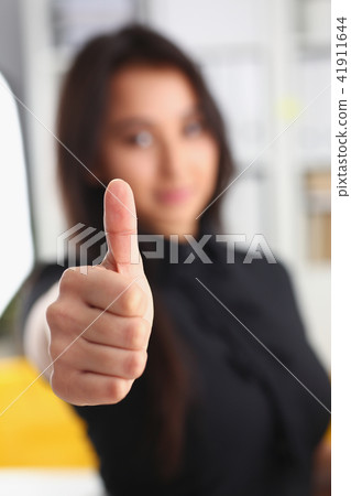 young pretty brunette woman show big finger closeup 41911644