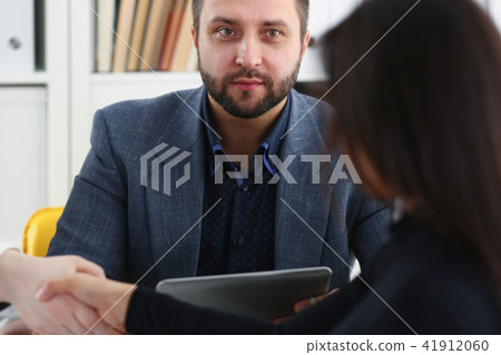 young happy businessmen have meeting in office shake hands with each other 41912060