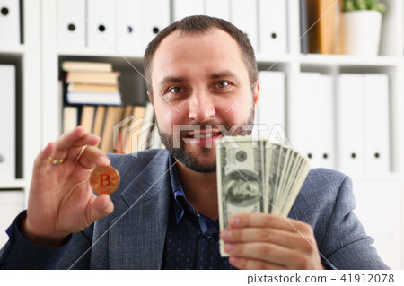 young successful businessman has just concluded a bargain satisfied with the result young successful businessman has just concluded a bargain satisfied with the result 41912078