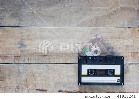 Two cassette in Black and clear color on wood. 41915241