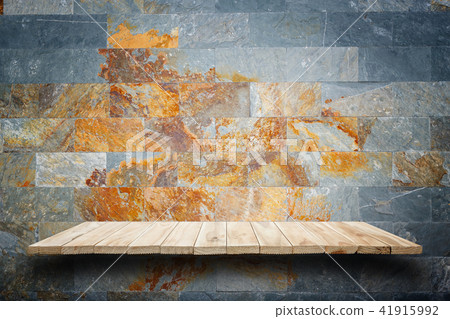 Empty wooden shelves and stone wall background. For product display 41915992