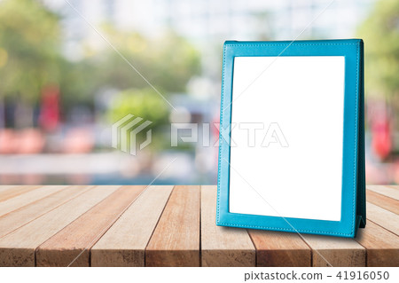 Empty blue brochure put on wooden table for text, menu or advertising 41916050