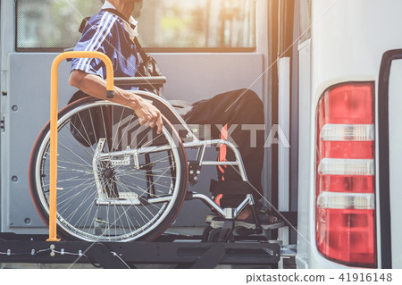 Disabled people sitting on wheelchair and going to the public bus Disabled people sitting on wheelchair and going to the public bus 41916148