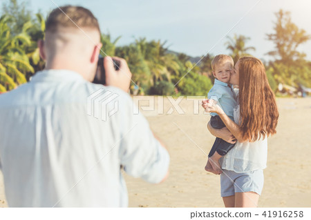 Father, Mother and Kid with relax activity, walking and playing on the tropical beach 41916258