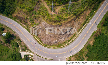 Asphalt road on the hill in Phetchabun province, Thailand. Aerial view from flying drone. Asphalt road on the hill in Phetchabun province, Thailand. Aerial view from flying drone. 41916497
