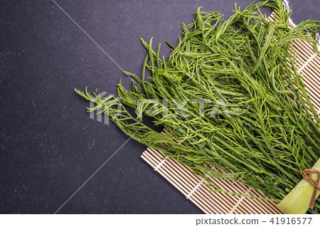 Top view fresh green Acacia pennata on black stone 41916577