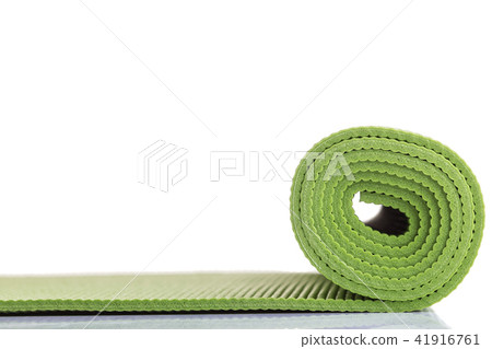 New green soft Yoga mat. Studio shot isolated on white New green soft Yoga mat. Studio shot isolated on white 41916761
