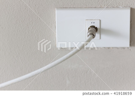 White tv plug on white wall. White tv plug on white wall. 41918659