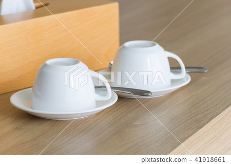 White cups coffee set on wooden table. White cups coffee set on wooden table. 41918661