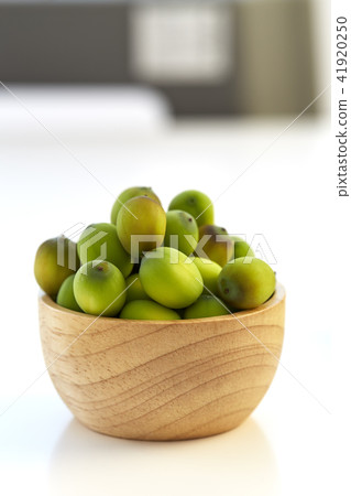 Lotus seeds put in a wooden cup Lotus seeds put in a wooden cup 41920250