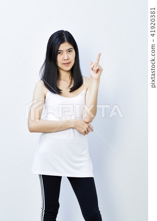 Young cute asian woman pointing Young cute asian woman pointing 41920381
