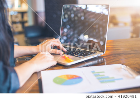 Businessmen are using computer to analysis graphs Businessmen are using computer to analysis graphs 41920481