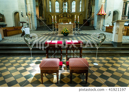 Wedding arrangement chairs inside The Basilica of St. Castor oldest church in Koblenz German state Wedding arrangement chairs inside The Basilica of St. Castor oldest church in Koblenz German state 41921197