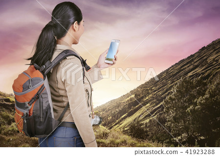 Attractive asian traveler woman with backpack Attractive asian traveler woman with backpack 41923288