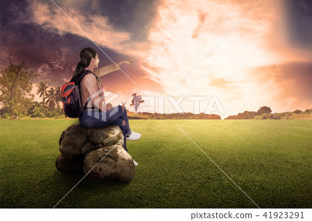 Rear view of asian traveler woman sitting Rear view of asian traveler woman sitting 41923291