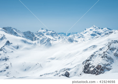 Winter snow covered mountain peaks in Caucasus. Great place for winter sports Winter snow covered mountain peaks in Caucasus. Great place for winter sports 41924698
