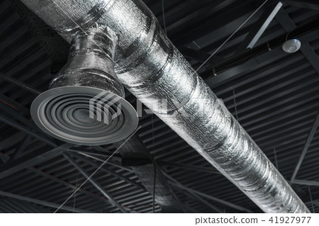 Ventilation system on the ceiling of large buildings. Ventilation pipes in silver insulation 41927977