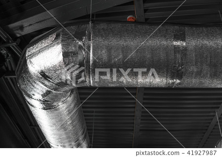 Ventilation system on the ceiling of large buildings. Ventilation pipes in silver insulation Ventilation system on the ceiling of large buildings. Ventilation pipes in silver insulation 41927987