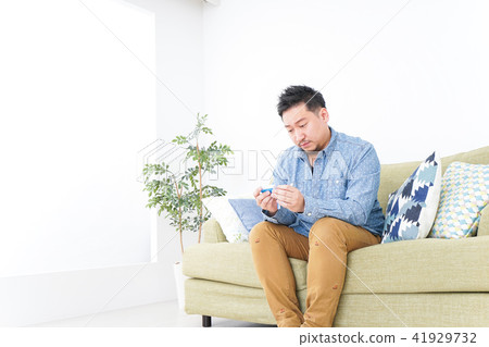 A man studying at home A man studying at home 41929732