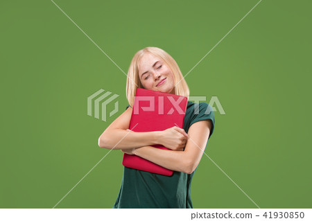 Businesswoman hugging laptop. Love to computer concept. Attractive female half-length front portrait Businesswoman hugging laptop. Love to computer concept. Attractive female half-length front portrait 41930850