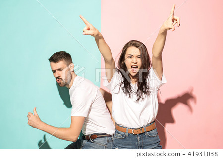 A couple of young man and woman dancing hip-hop at studio. A couple of young man and woman dancing hip-hop at studio. 41931038