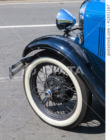 Classic old blue car, detail of the wheel. 41931167