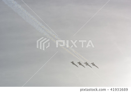 Air show sky (U.S. Navy fighter flying with sunlight) Air show sky (U.S. Navy fighter flying with sunlight) 41931689