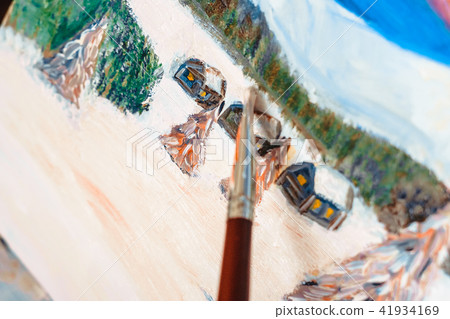 the artist paints with oil 41934169