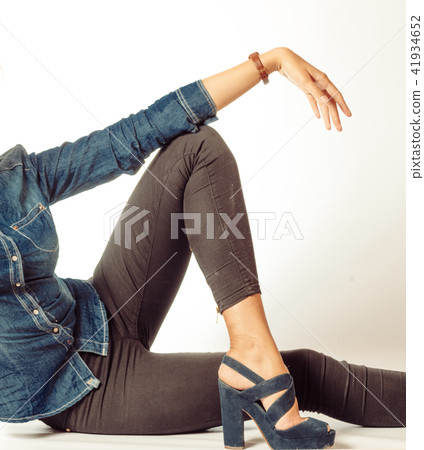 long girlish legs in jeans and hand on a lot of copyspace 41934652